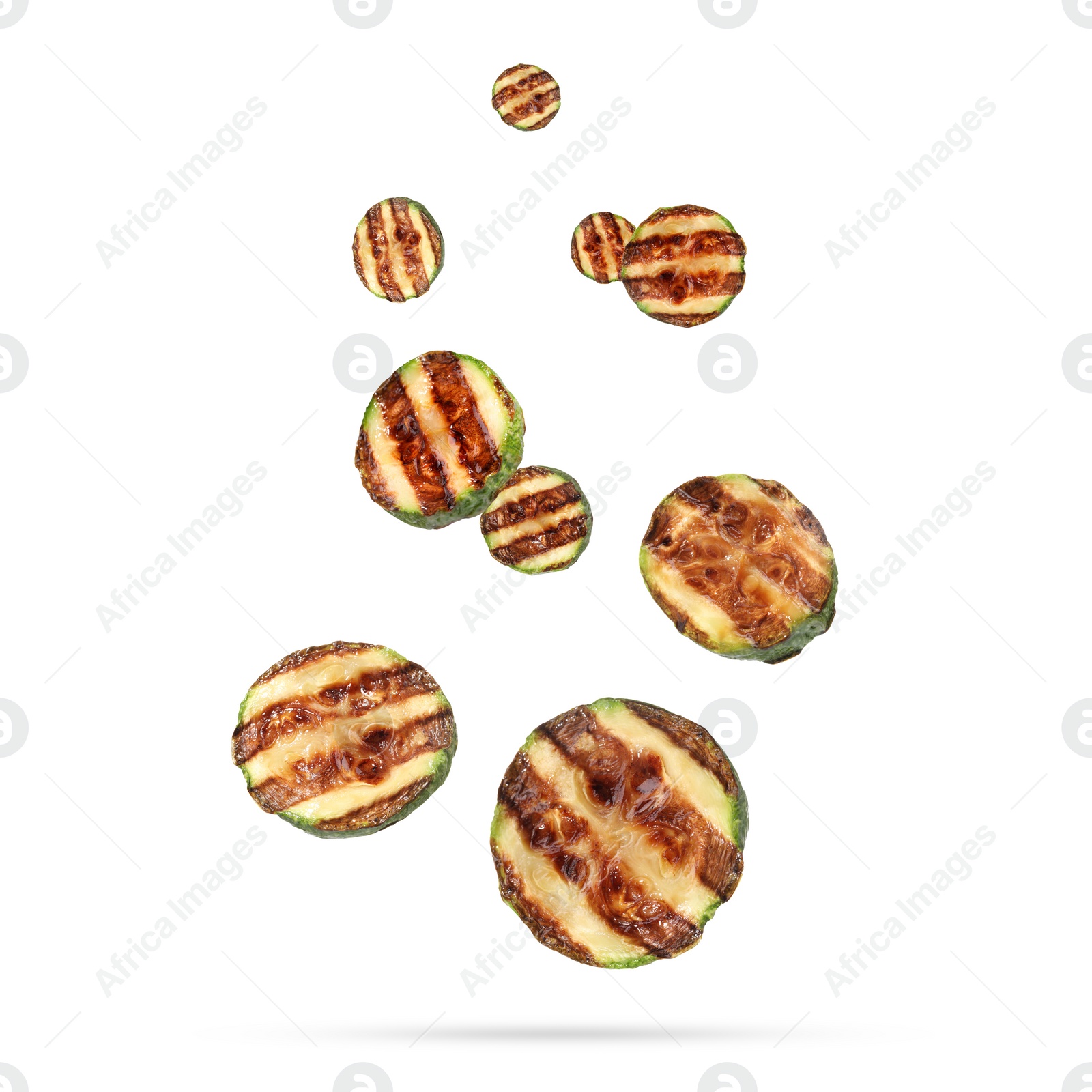 Image of Slices of grilled zucchinis in air on white background