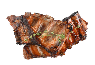 Photo of Tasty grilled ribs with thyme isolated on white, top view