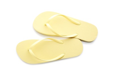 Photo of Stylish yellow flip flops on white background, top view