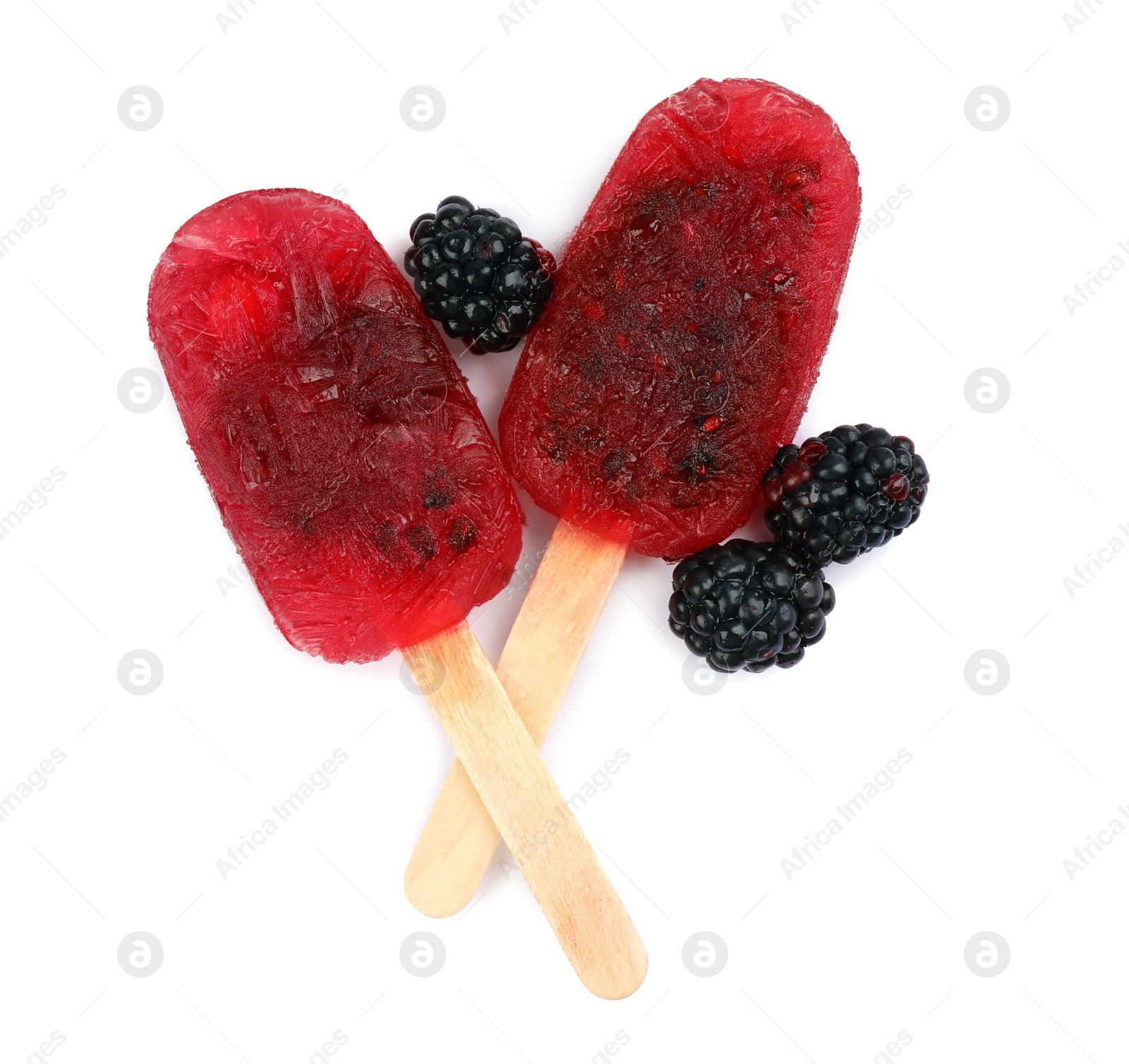 Photo of Delicious ice pops and fresh blackberries on white background, top view. Fruit popsicle