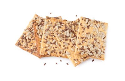 Photo of Cereal crackers with flax, sunflower and sesame seeds isolated on white, above view