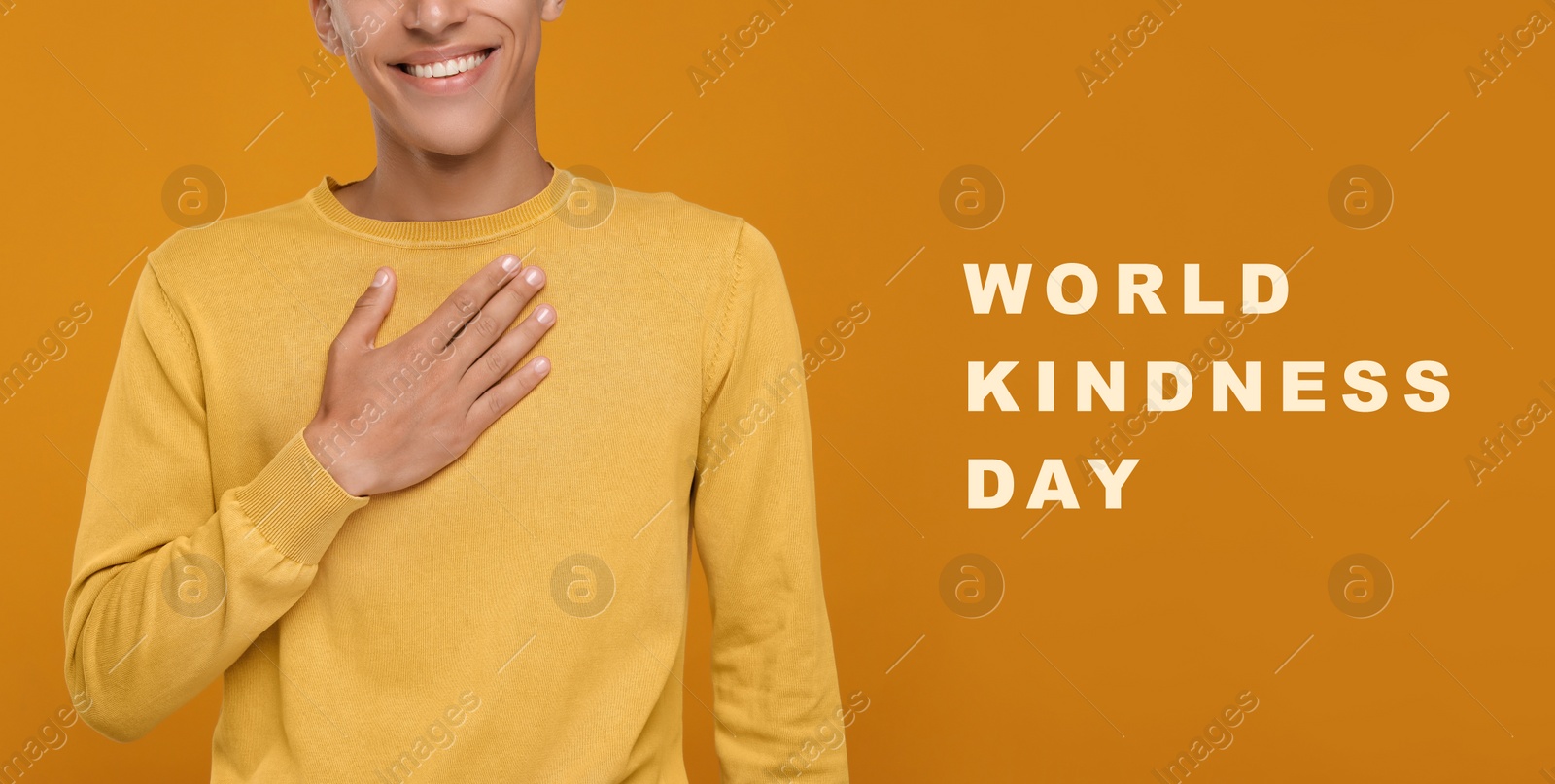 Image of World Kindness Day. Grateful man pressing hand to chest on orange background, closeup. Banner design