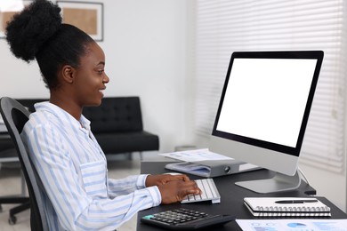 Photo of Professional accountant working on computer at desk in office