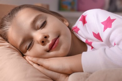 Photo of Cute little girl sleeping in bed at home, closeup