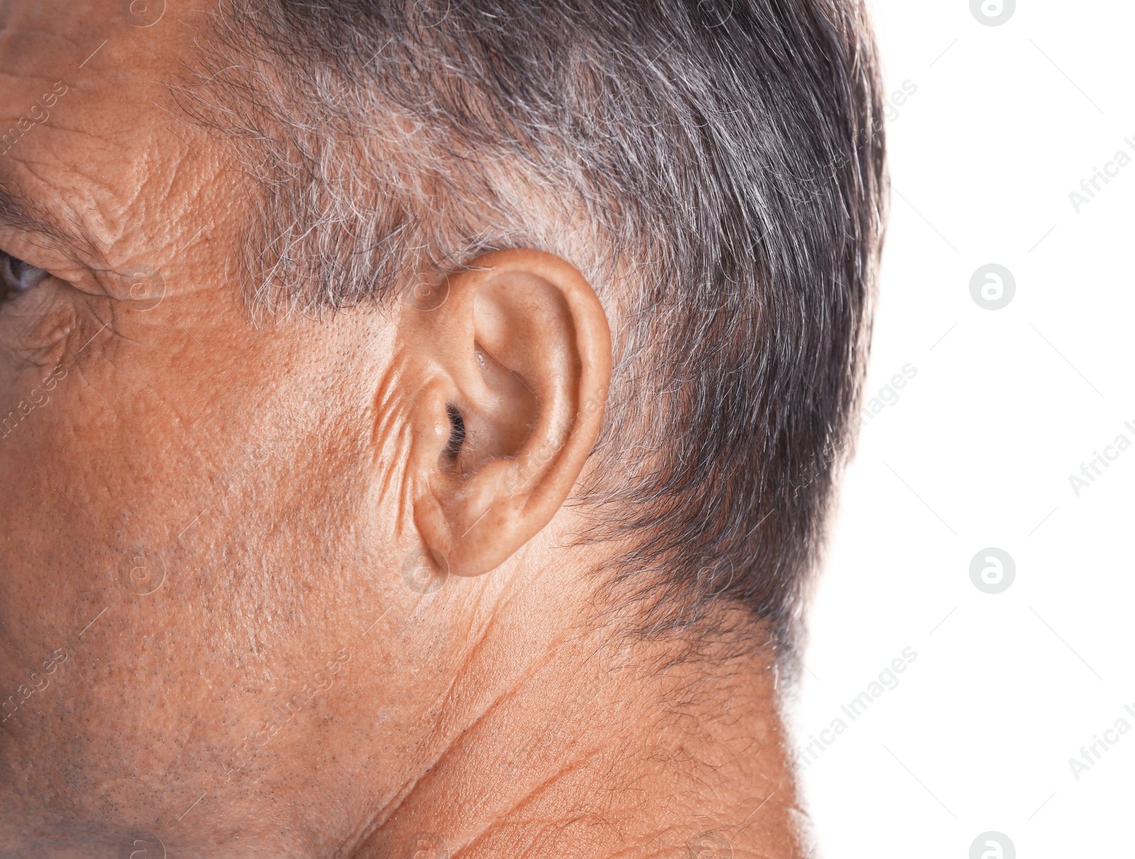 Photo of Mature man on white background, closeup. Hearing problem