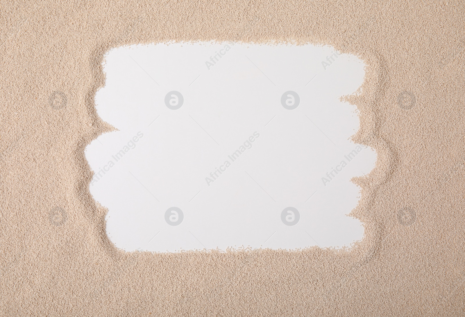 Photo of Frame made of granulated yeast, top view. Space for text