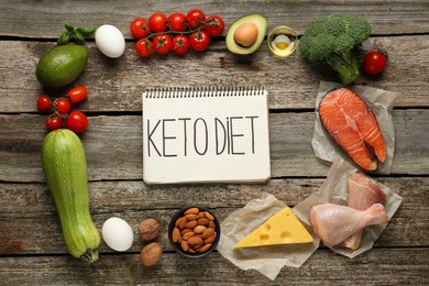 Flat lay composition with keto diet products on wooden table