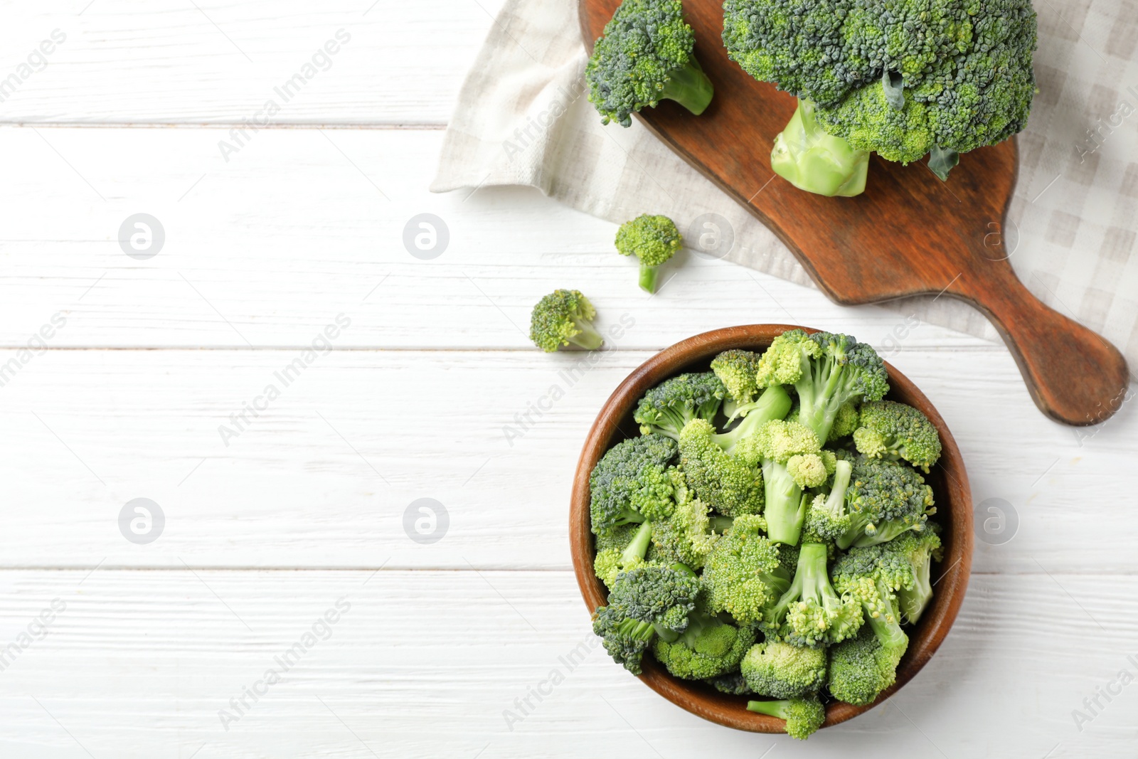 Photo of Flat lay composition with fresh green broccoli on wooden background