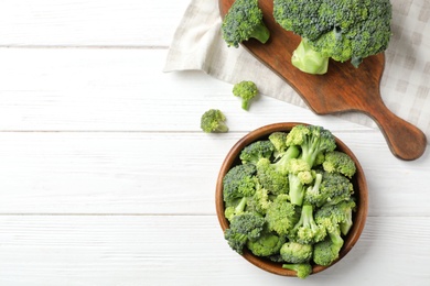 Photo of Flat lay composition with fresh green broccoli on wooden background