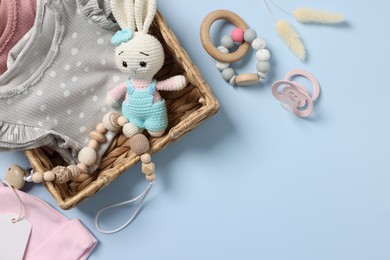 Photo of Flat lay composition with different baby accessories on light blue background, space for text