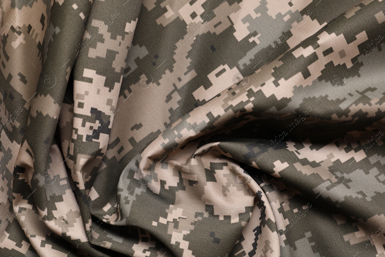 Photo of Texture of crumpled camouflage fabric as background, top view