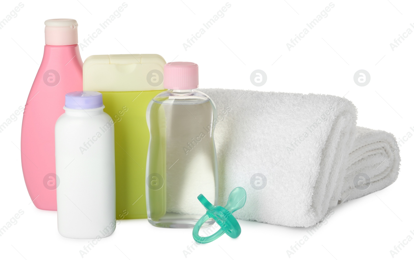 Photo of Bottles of baby cosmetic products, towels and pacifier on white background