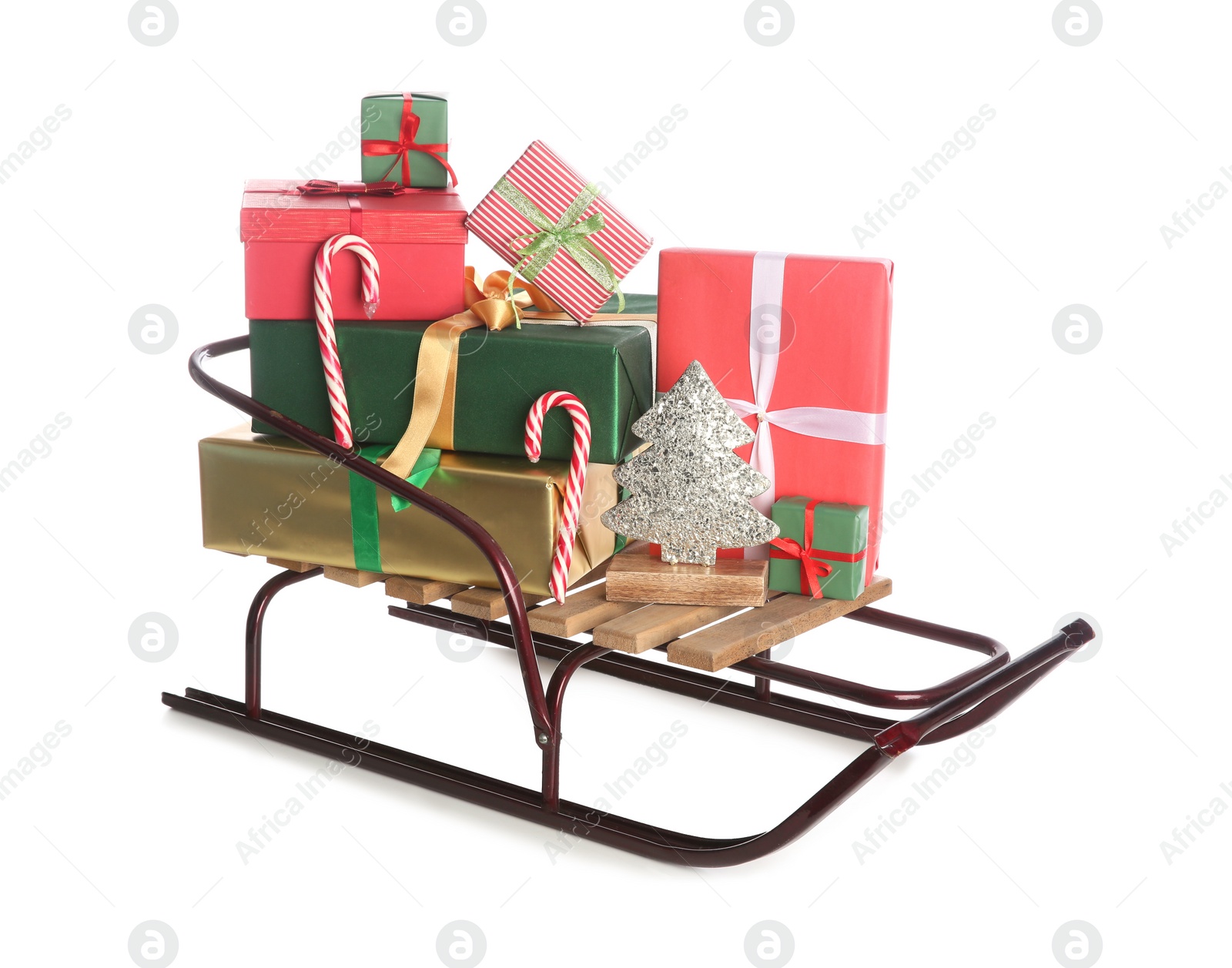 Photo of Sleigh with Christmas gifts on white background