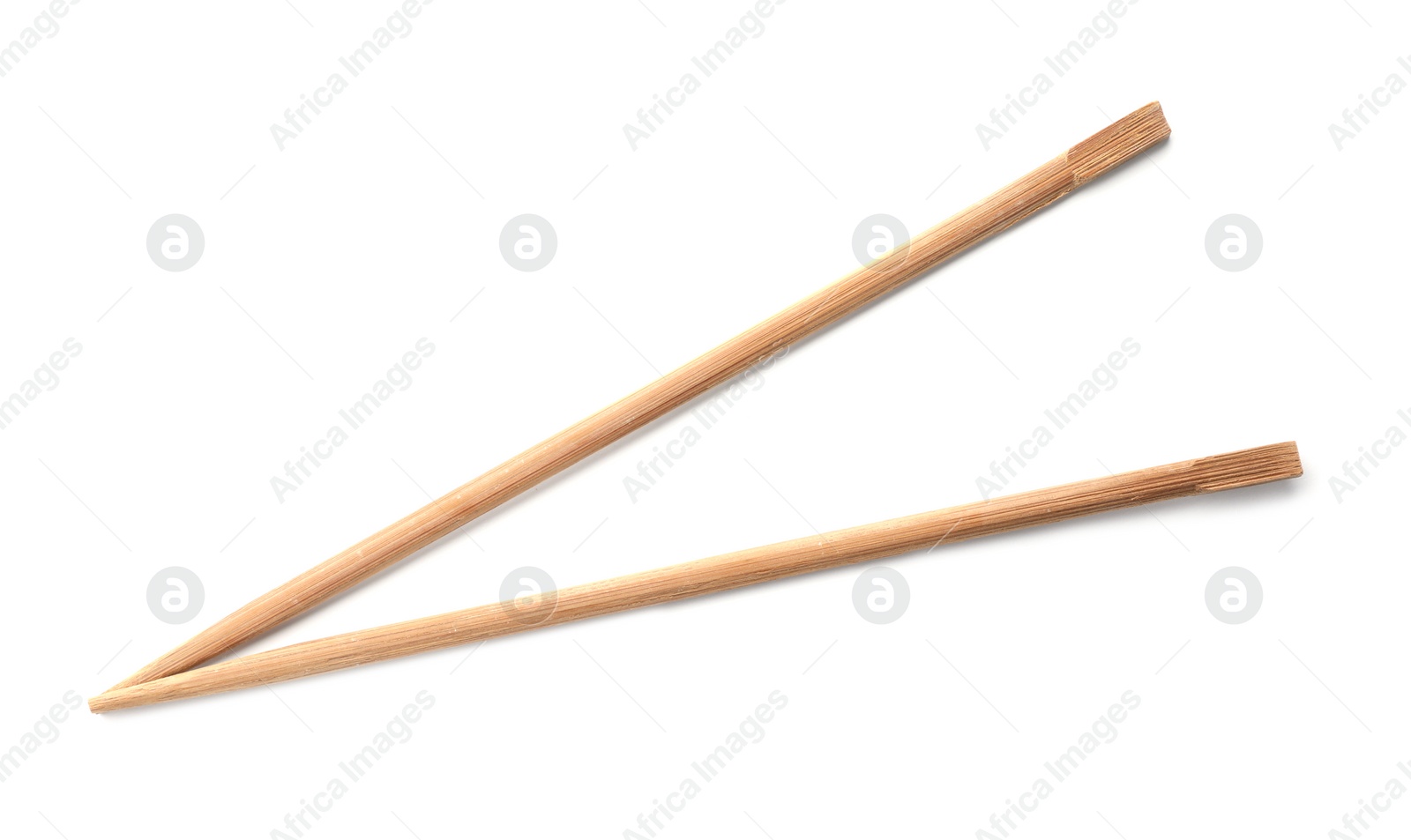 Photo of Chopsticks made of bamboo on white background, top view