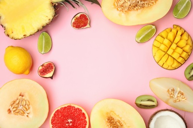 Photo of Frame made of melon, other fruits and space for text on color background, top view