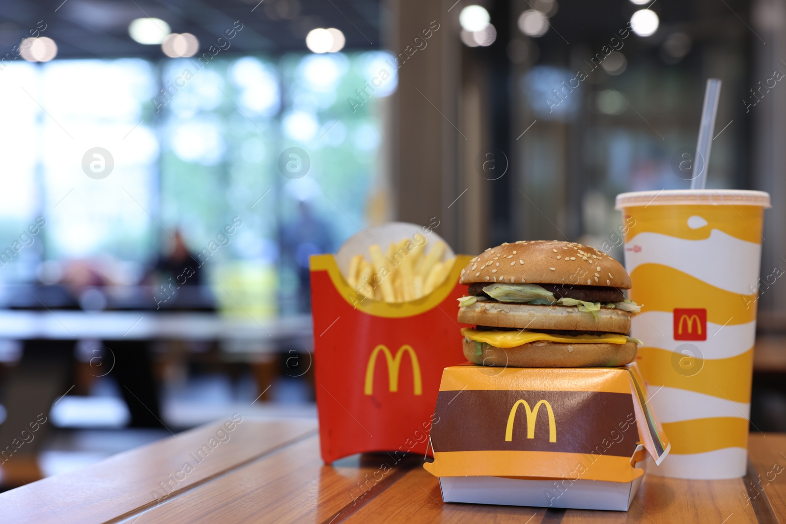 Photo of Lviv, Ukraine - October 9, 2023: McDonald's menu on wooden table in restaurant, space for text