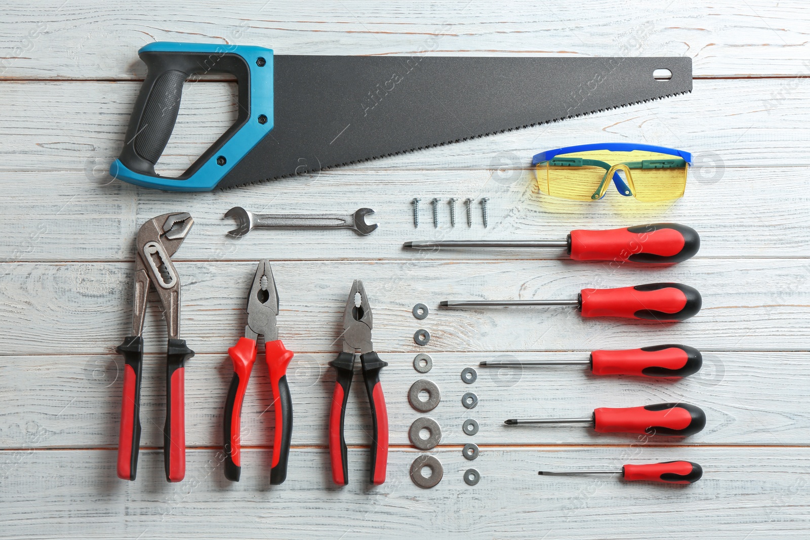 Photo of Flat lay composition with construction tools on wooden background