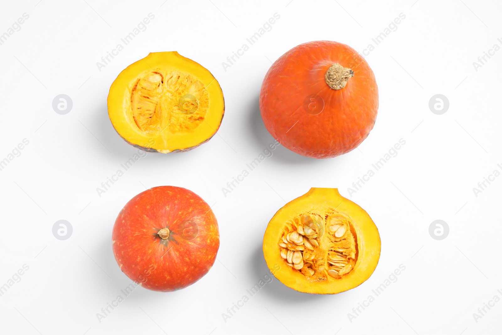 Photo of Fresh ripe pumpkins on white background, top view. Holiday decoration