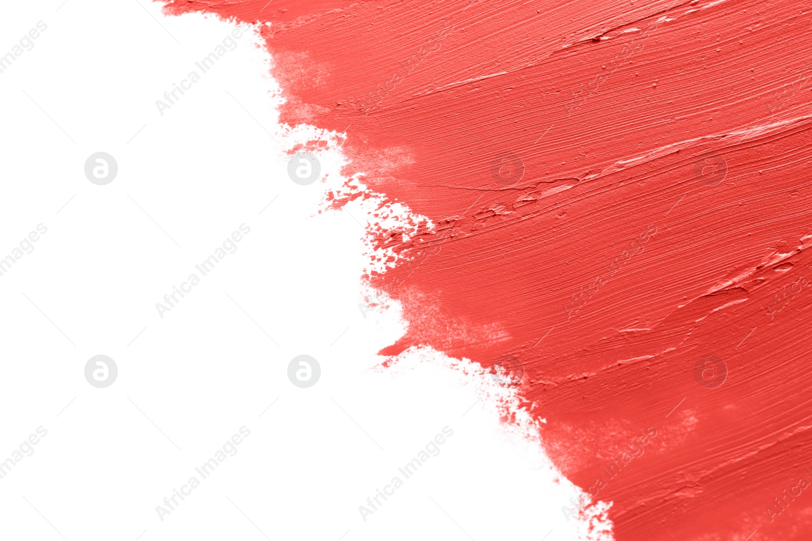 Photo of Red lipstick smears on white background, closeup. Space for text