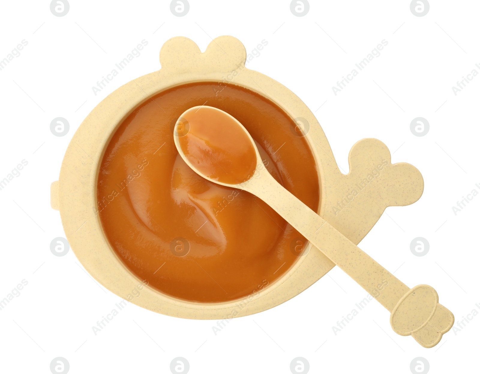 Photo of Bowl and spoon with tasty pureed baby food isolated on white, top view