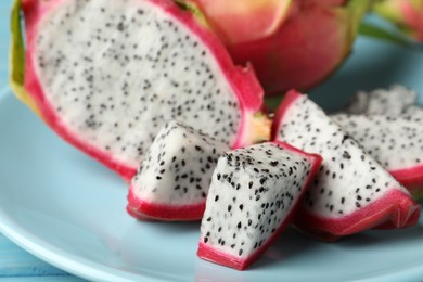 Plate with delicious cut white pitahaya fruit, closeup