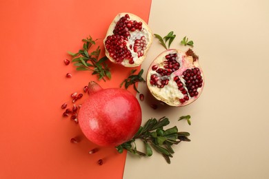 Flat lay composition with ripe pomegranates on color background