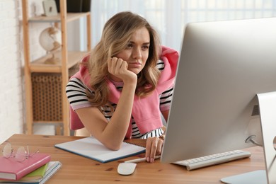 Photo of Online test. Woman studying with computer at home