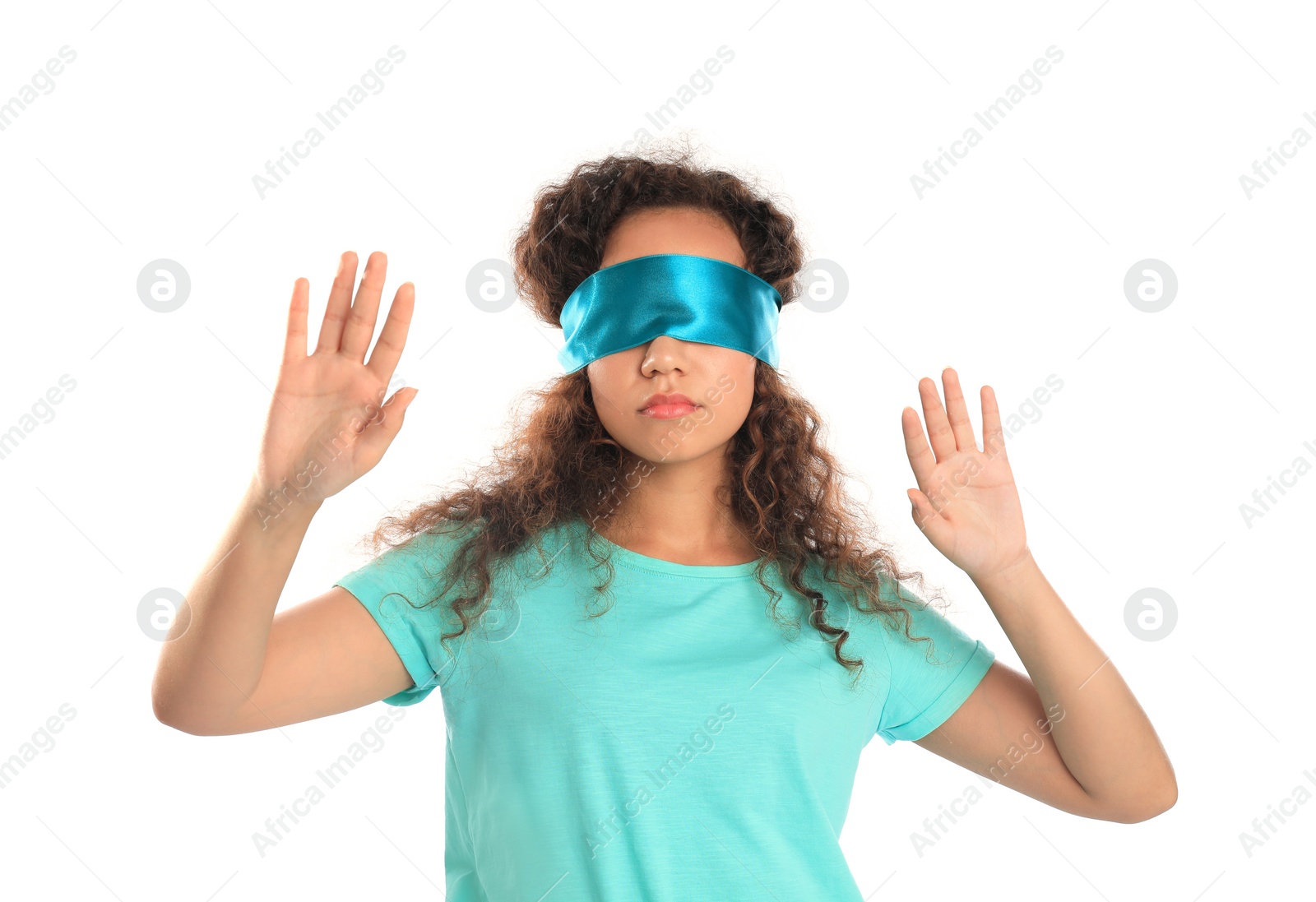 Photo of Young African-American woman with light blue blindfold on white background