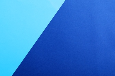 Photo of Blue paper sheets as colorful background, top view