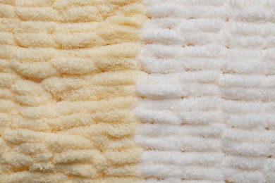 Photo of Soft knitted fabric as background, top view