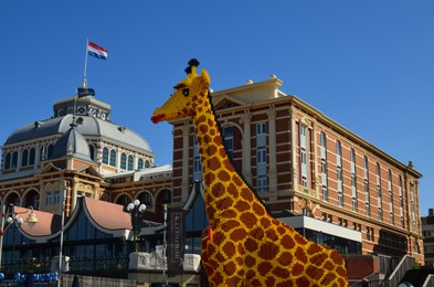 AMSTERDAM, NETHERLANDS - SEPTEMBER 10, 2022: Giraffe figure made with colorful Lego constructor outdoors