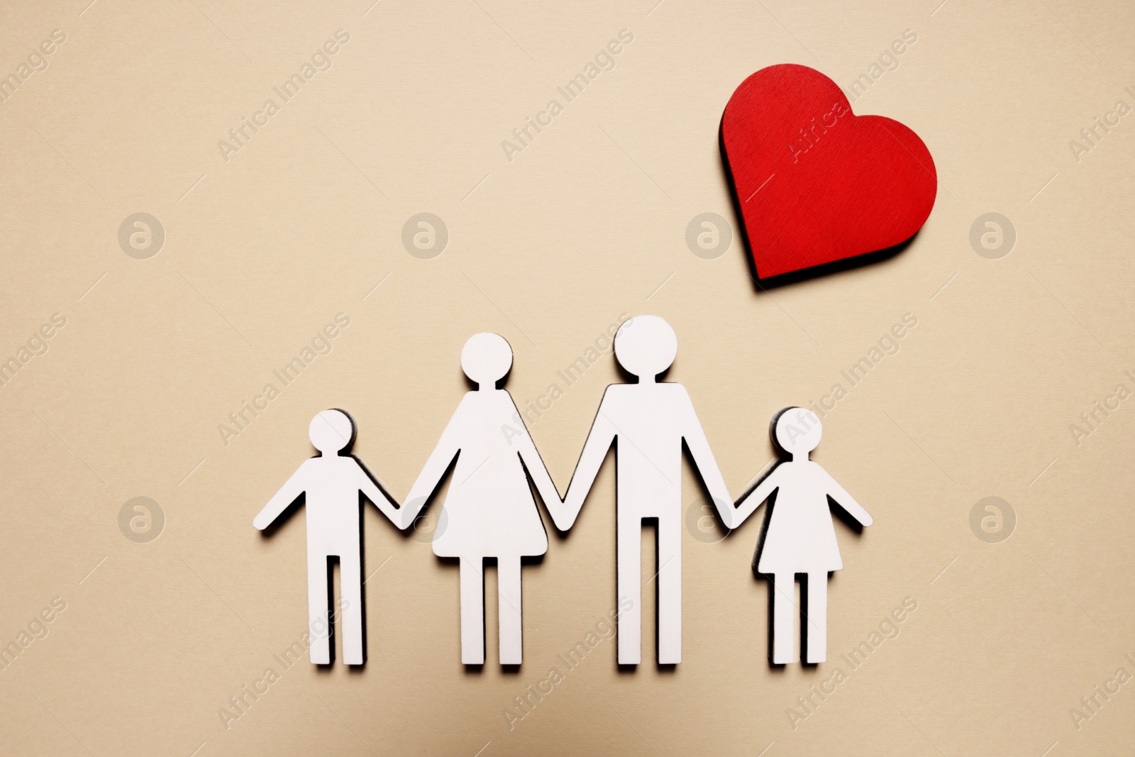 Photo of Figures of family and heart on beige background, top view. Insurance concept