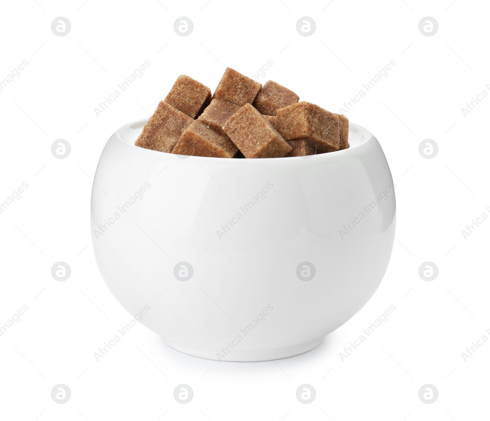 Photo of Ceramic bowl with brown sugar cubes isolated on white