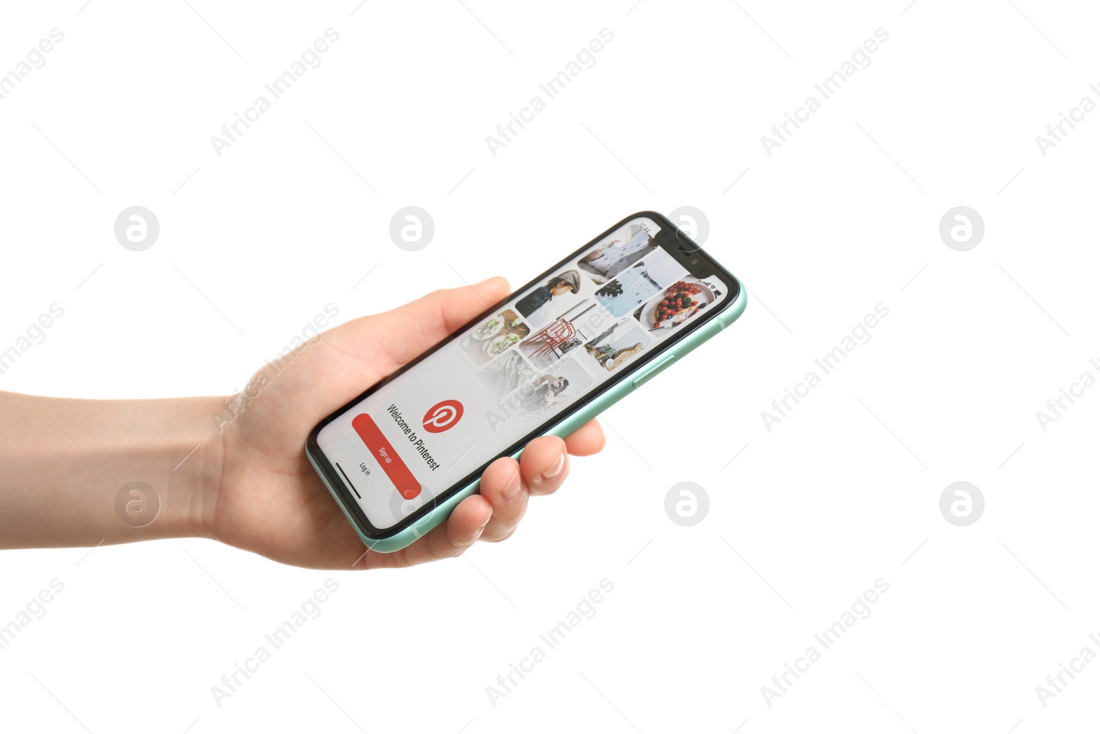 Photo of MYKOLAIV, UKRAINE - JULY 9, 2020: Woman holding  iPhone X with Pinterest app on white background, closeup