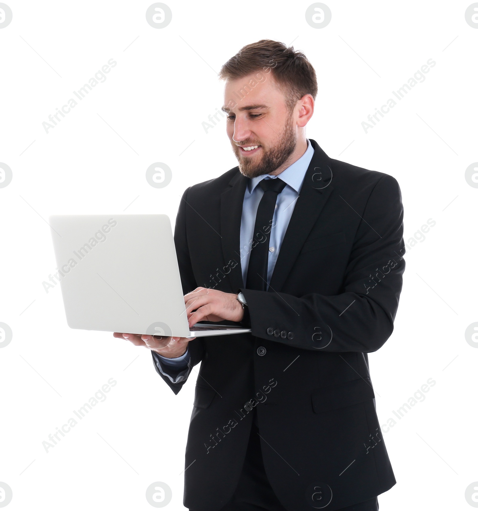 Photo of Happy young businessman using laptop on white background