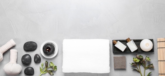 Photo of Flat lay composition with spa accessories and space for text on light background