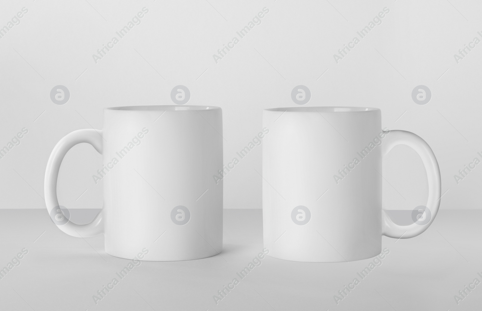 Image of Blank ceramic mugs on white background. Mockup for design