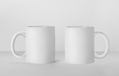 Image of Blank ceramic mugs on white background. Mockup for design