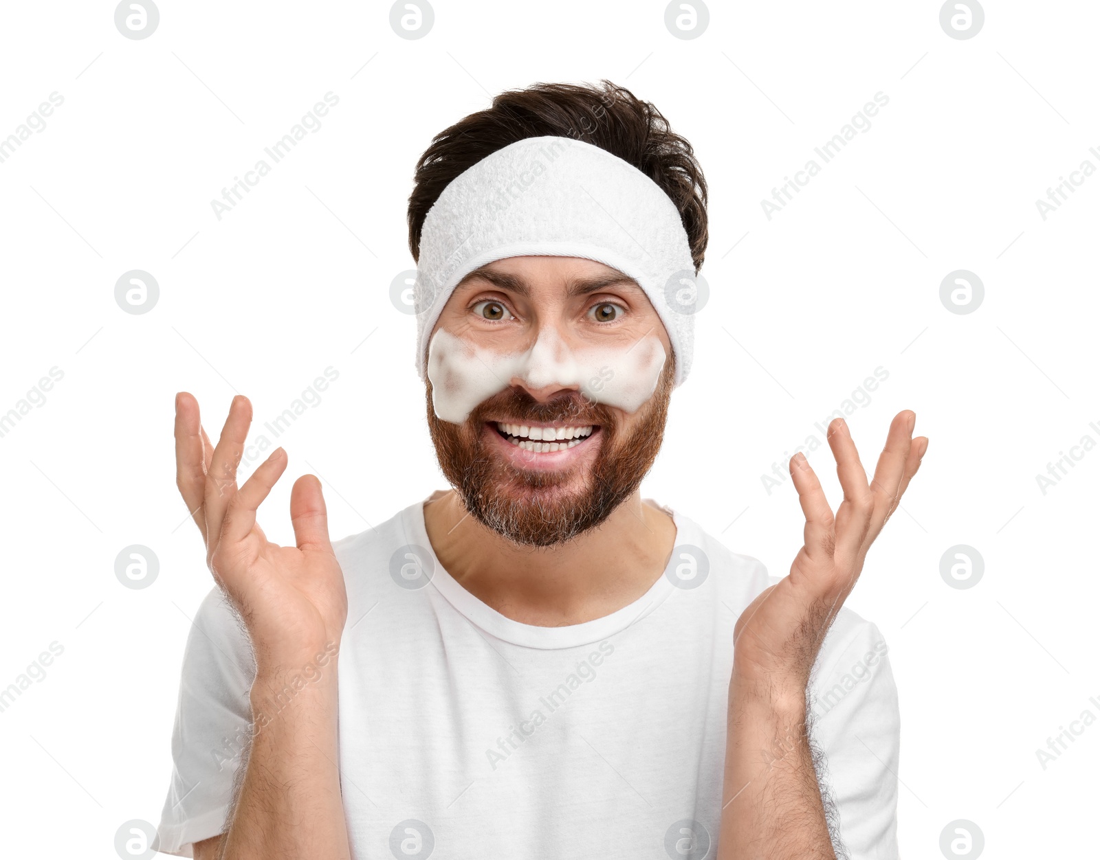 Photo of Man with headband washing his face on white background