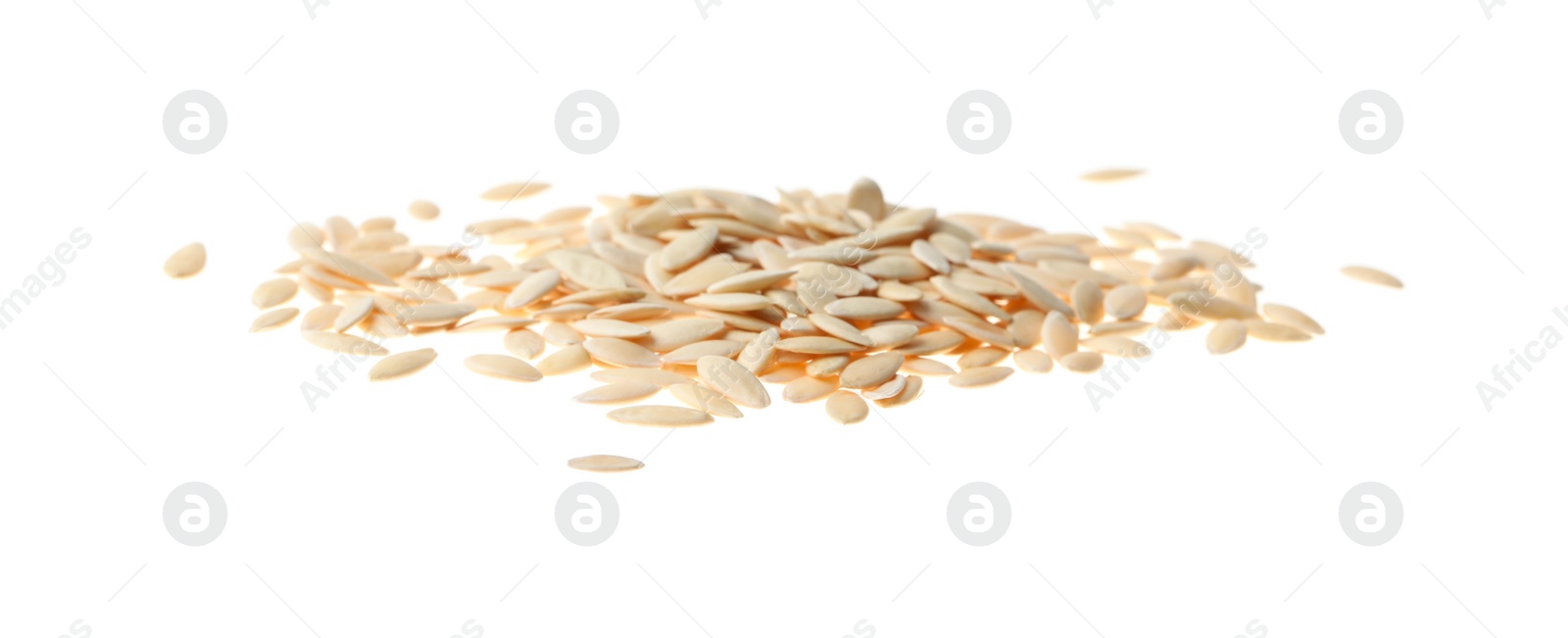 Photo of Pile of raw cucumber seeds on white background. Vegetable planting