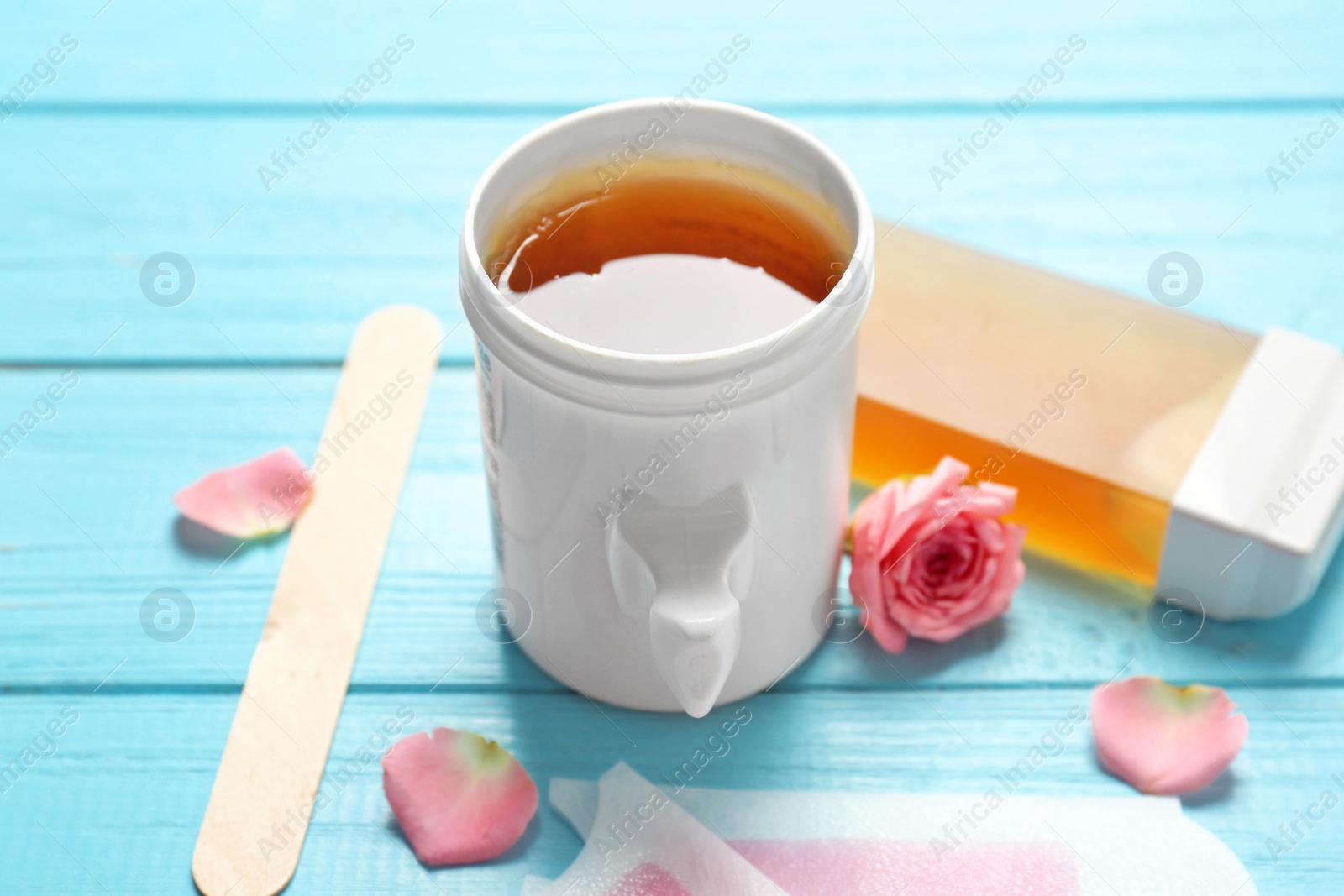 Photo of Set for epilation on wooden background