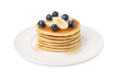 Photo of Delicious pancakes with banana slices, blueberries and honey isolated on white