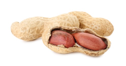 Fresh peanuts isolated on white. Healthy snack