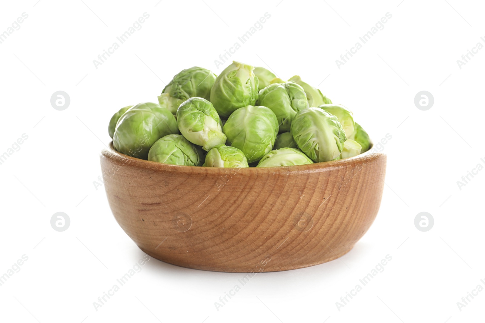 Photo of Bowl of fresh Brussels sprouts isolated on white