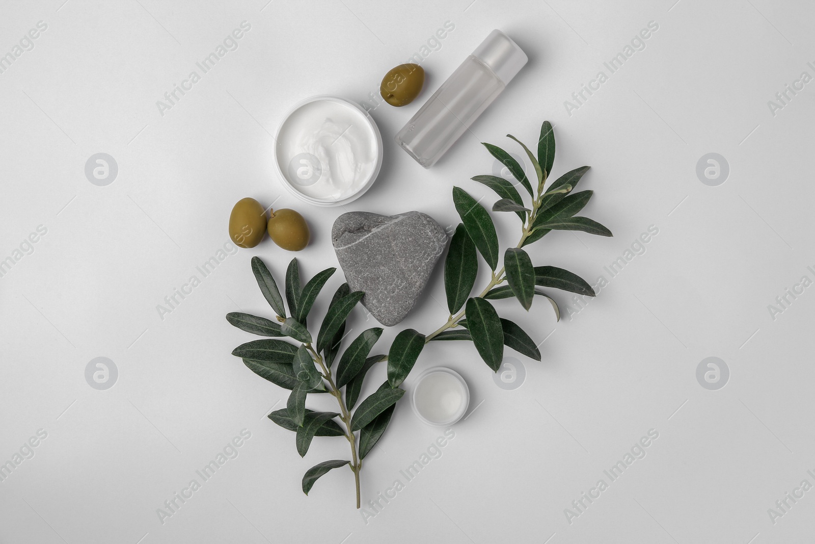 Photo of Flat lay composition with different cosmetic products and olives on white background