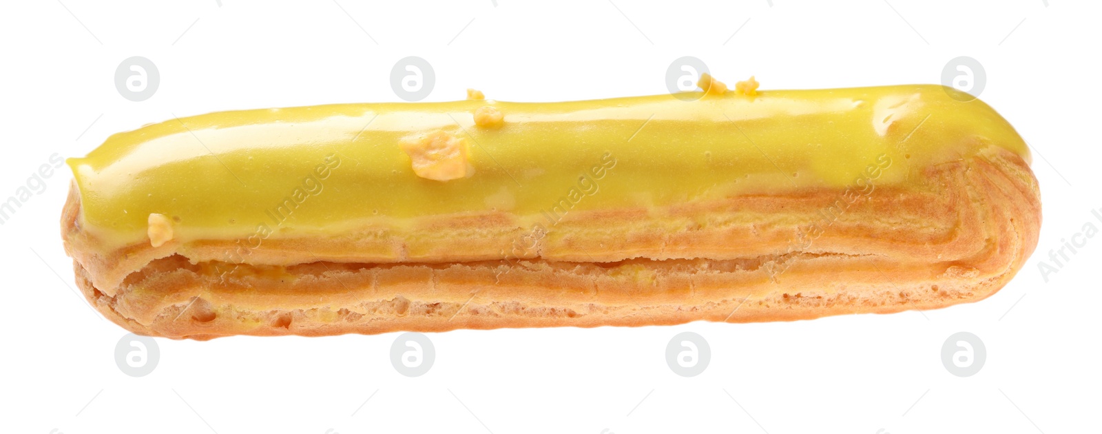 Photo of Delicious eclair covered with yellow glaze isolated on white