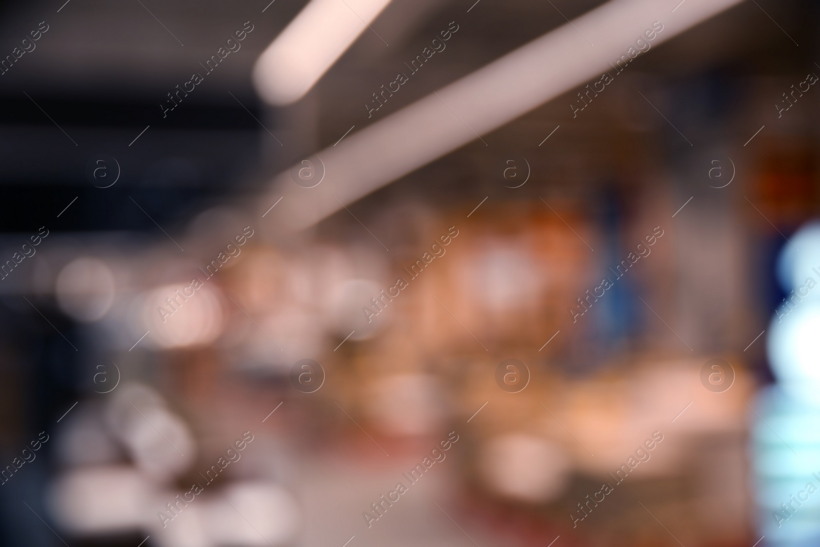 Photo of Blurred view of modern shopping mall interior