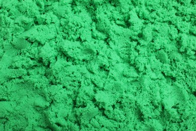 Photo of Green kinetic sand as background, closeup view