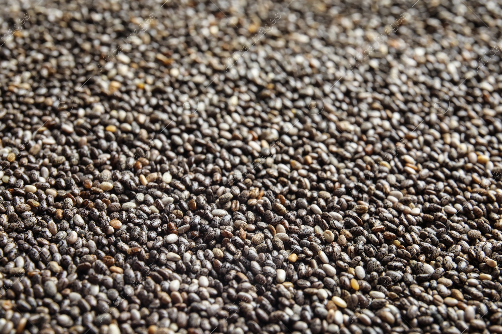 Photo of Chia seeds as background, closeup view. Organic superfood