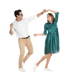 Beautiful young couple dancing on white background